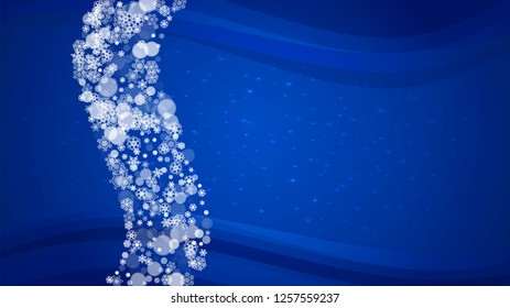 New Year border on blue background. Horizontal winter theme. Christmas and New Year border with snowflakes  falling. For season sales, special offer, banners, cards, party invites, flyers. White snow