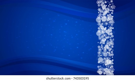 New Year border on blue background. Horizontal winter theme. Christmas and New Year border with snowflakes  falling. For season sales, special offer, banners, cards, party invites, flyers. White snow