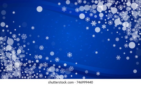 New Year border on blue background. Horizontal winter theme. Christmas and New Year border with snowflakes  falling. For season sales, special offer, banners, cards, party invites, flyers. White snow