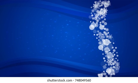 New Year border on blue background. Horizontal winter theme. Christmas and New Year border with snowflakes  falling. For season sales, special offer, banners, cards, party invites, flyers. White snow