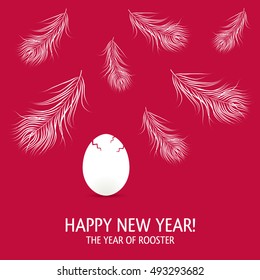 New year card with egg and feathers. The year 2017 of rooster