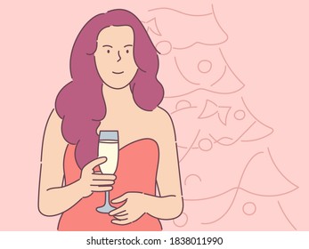 New Year celebration, festive mood concept. Young happy girl with a glass of champagne on new year's tree