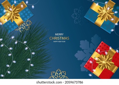 New Year and Christmas background. Branches of a Christmas tree and Christmas gifts on a dark background.
