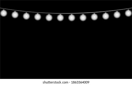 new year christmas bulbs in a garland glow on a black background