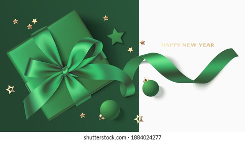 New Year and Christmas greeting card design template. Xmas green background with green ball, star, gift box and gold star confetti. Flat lay. Vector stock illustration.