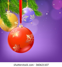 New year composition with firs branches and Christmas balls on blurred background