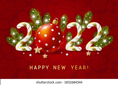 New Year concept - 2022 candy numbers with Christmas decor on red snowflakes background for winter holidays design