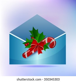 new year envelope with a piece of candy and a Christmas sprig