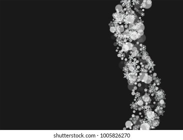 New Year frame with cold snowflakes on black horizontal background. Christmas and New Year frame for gift certificates, ads, banners, flyers, sales offers, event invitations. Falling snow and bokeh