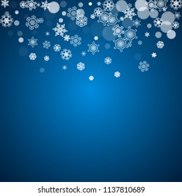 New Year frame with cold snowflakes on blue background. Winter window. Christmas and New Year frame for gift certificates, ads, banners, flyers, sales offers, event invitations. Falling snow and bokeh