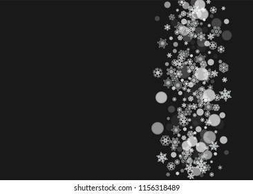 New Year frame with cold snowflakes on black horizontal background. Christmas and New Year frame for gift certificates, ads, banners, flyers, sales offers, event invitations. Falling snow and bokeh