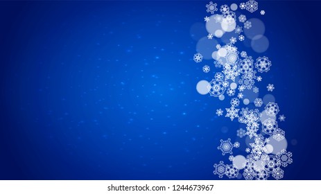 New Year frame with cold snowflakes on blue horizontal background with sparkles. Christmas and New Year frame for gift certificates, ads, banners, flyers, sales offers, event invitations. Falling snow