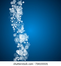New Year frame with cold snowflakes on blue background. Winter window. Christmas and New Year frame for gift certificates, ads, banners, flyers, sales offers, event invitations. Falling snow and bokeh