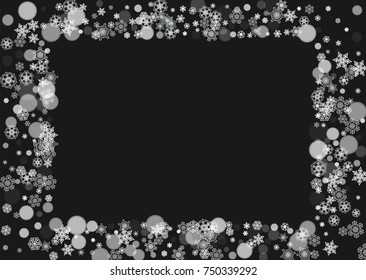 New Year frame with cold snowflakes on black horizontal background. Christmas and New Year frame for gift certificates, ads, banners, flyers, sales offers, event invitations. Falling snow and bokeh