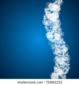 New Year frame with cold snowflakes on blue background. Winter window. Christmas and New Year frame for gift certificates, ads, banners, flyers, sales offers, event invitations. Falling snow and bokeh