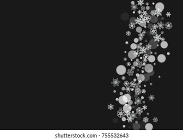 New Year frame with cold snowflakes on black horizontal background. Christmas and New Year frame for gift certificates, ads, banners, flyers, sales offers, event invitations. Falling snow and bokeh