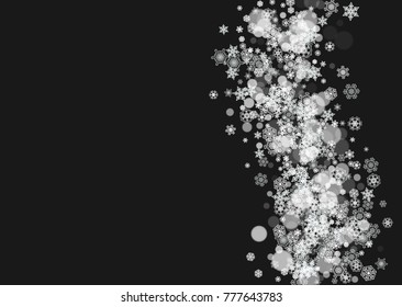 New Year frame with cold snowflakes on black horizontal background. Christmas and New Year frame for gift certificates, ads, banners, flyers, sales offers, event invitations. Falling snow and bokeh