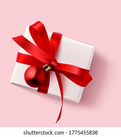 New year gift box with red bow and christmas ball isolated on pink background. Christmas decoration. Vector illustration

