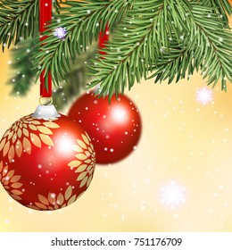 New Year golden background with branches of a Christmas tree and red balls