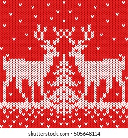 New Year. Knitted pattern with a snow .Christmas deer around the Christmas tree