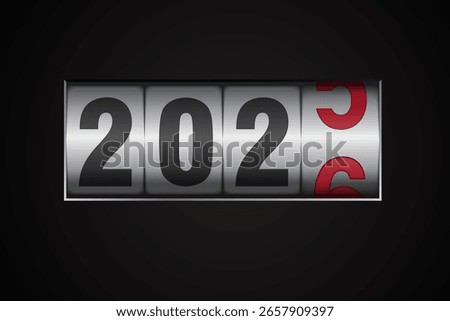 New year mechanical counter showing 2025 switching to 2026 on black background