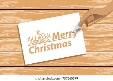 new year n. A table with a white blank sheet and a hand with a brush for drawing. vector illustration for your design