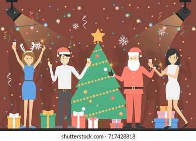 New year party. People in santa hat have fun at the club.