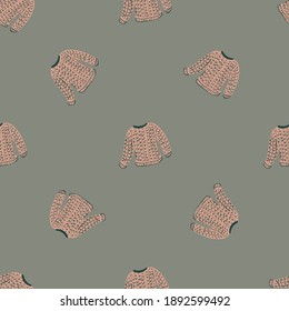 New year seamless cozy pattern with sweater pale pink silhouettes on grey background. Flat vector print for textile, fabric, giftwrap, wallpapers. Endless illustration.