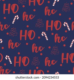 New Year seamless pattern with lettering, Christmass tree and candy on blue background. Santa's text HO ho ho in red color. For textile, wrapping paper, greeting card etc. Christmass illustration

