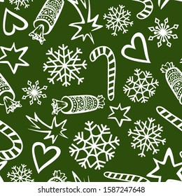 New Year seamless pattern on a green background. White snowflakes, stars, crackers and Christmas candies are scattered randomly. Vector for greeting cards, backgrounds, wrapping paper.