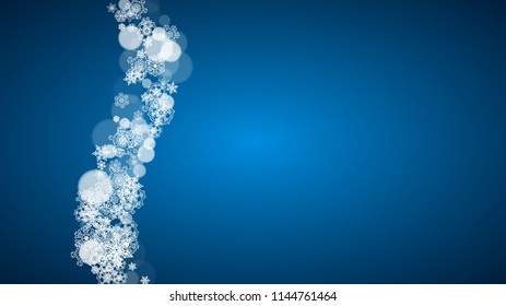 New Year snow on blue background. Winter theme. Horizontal Christmas and New Year snow falling backdrop. For season sale, special offer, banners, card, party invites, flyers. White snowflakes on blue.