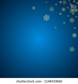 New Year snow on blue background. Gold glitter snowflakes. Christmas and New Year snow falling backdrop. For season sales, special offers, banners, cards, party invites, flyers. Frosty winter on blue.