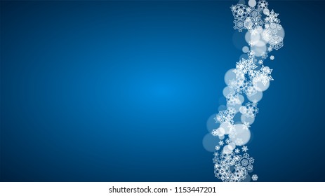 New Year snow on blue background. Winter theme. Horizontal Christmas and New Year snow falling backdrop. For season sale, special offer, banners, card, party invites, flyers. White snowflakes on blue.