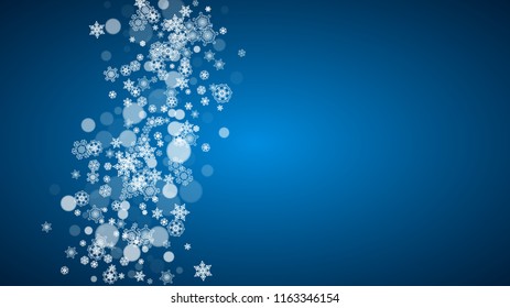 New Year snow on blue background. Winter theme. Horizontal Christmas and New Year snow falling backdrop. For season sale, special offer, banners, card, party invites, flyers. White snowflakes on blue.