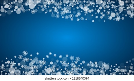 New Year snow on blue background. Winter theme. Horizontal Christmas and New Year snow falling backdrop. For season sale, special offer, banners, card, party invites, flyers. White snowflakes on blue.