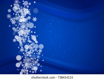 New Year snow on blue background. Winter theme. Horizontal Christmas and New Year snow falling backdrop. For season sale, special offer, banners, card, party invites, flyers. White snowflakes on blue.