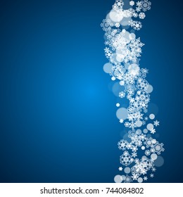 New Year snow on blue background. Winter theme. Christmas and New Year snow falling backdrop. For season sales, special offers, banners, cards, party invites, flyers. White frosty snowflakes on blue.