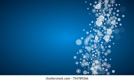 New Year snow on blue background. Winter theme. Horizontal Christmas and New Year snow falling backdrop. For season sale, special offer, banners, card, party invites, flyers. White snowflakes on blue.