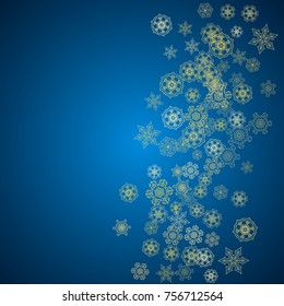 New Year snow on blue background. Gold glitter snowflakes. Christmas and New Year snow falling backdrop. For season sales, special offers, banners, cards, party invites, flyers. Frosty winter on blue.