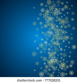 New Year snow on blue background. Gold glitter snowflakes. Christmas and New Year snow falling backdrop. For season sales, special offers, banners, cards, party invites, flyers. Frosty winter on blue.