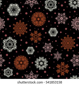 New year snowflake. Cute abstract seamless snowflakes vector design on black background. Flat snow doodle icons, snow flakes silhouette in red and orange colors for christmas banner, cards.