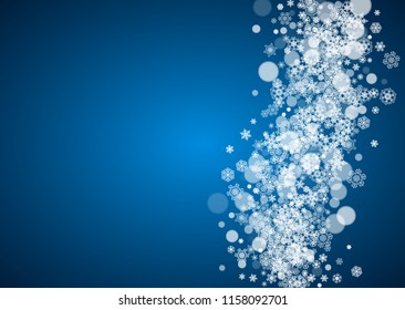 New Year snowflakes on blue background. Horizontal winter theme. Christmas and New Year snowflakes falling. For season sales, special offer, banners, cards, party invites, flyers. White frosty snow