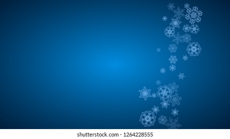 New Year snowflakes on blue background with sparkles. Horizontal Christmas and New Year snowflakes  falling. For season sales, special offer, banners, cards, party invites, flyer. White frosty snow