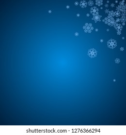 New Year snowflakes on blue background with sparkles. Winter theme. Christmas and New Year snowflakes  falling. For season sales, special offer, banners, cards, party invites, flyer. White frosty snow