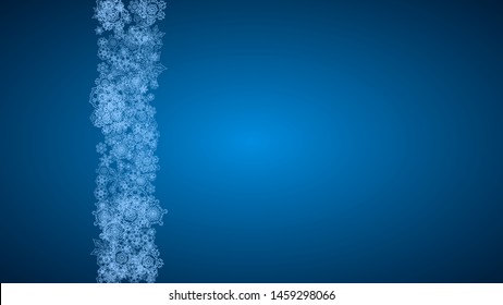 New Year snowflakes on blue background with sparkles. Horizontal Christmas and New Year snowflakes falling. For season sales, special offer, banners, cards, party invites, flyer. White frosty snow