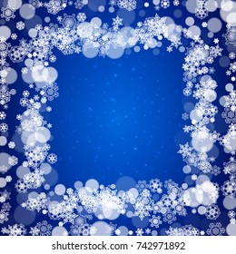 New Year snowflakes on blue background with sparkles. Winter theme. Christmas and New Year snowflakes falling. For season sales, special offer, banners, cards, party invites, flyers. White frosty snow