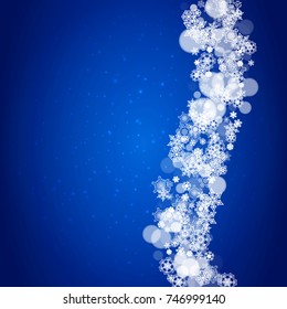New Year snowflakes on blue background with sparkles. Winter theme. Christmas and New Year snowflakes falling. For season sales, special offer, banners, cards, party invites, flyers. White frosty snow