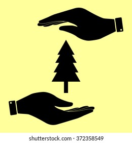 New year tree sign. Save or protect symbol by hands.