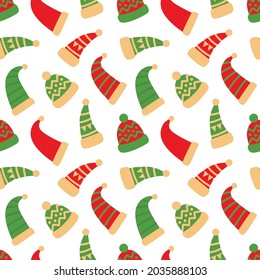 New Year vector pattern with winter hats in green and red colors. Seamless winter illustration with hats and caps for printing on fabric, gift paper and packaging, etc