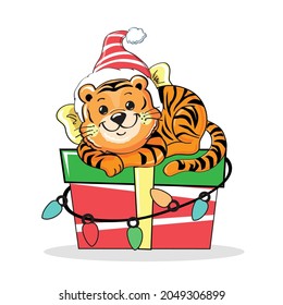 New Year's cartoon tiger cub lies on a box with a gift. Vector illustration isolated. Postcard for the holidays. Symbol of the year 2022